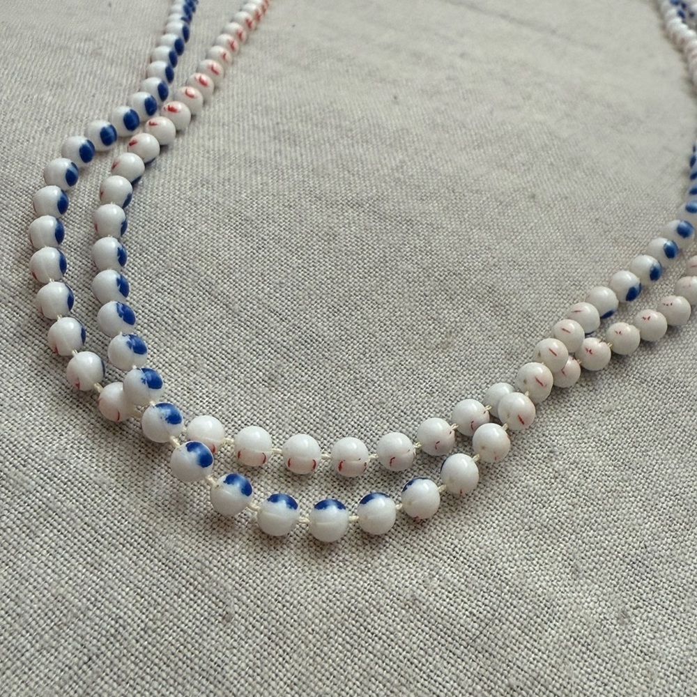 White Beaded Necklace with Blue and Red- Orange Accent Beads